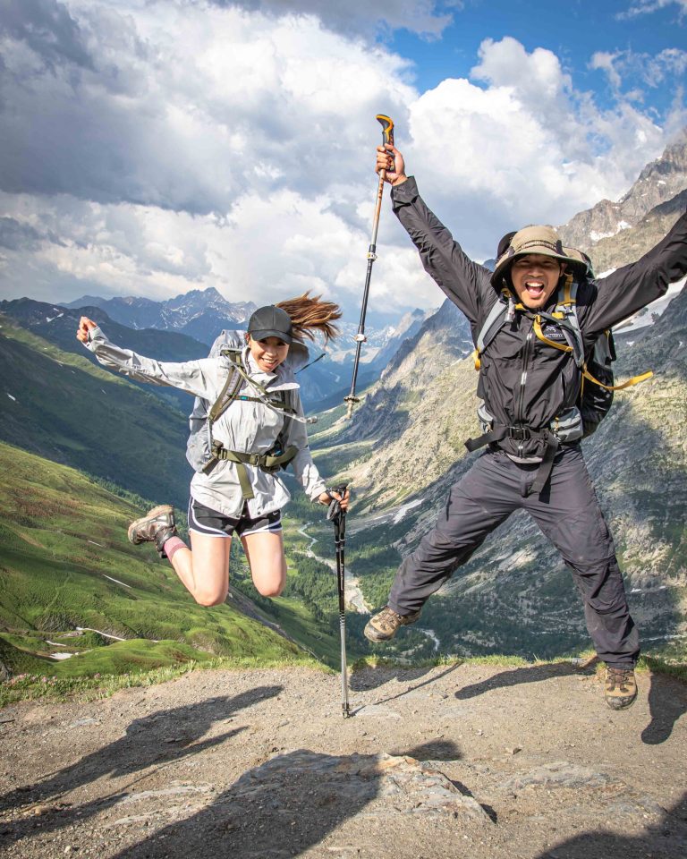 Happy Hikers jumping in Val Ferret, guided Tour du Mont Blanc