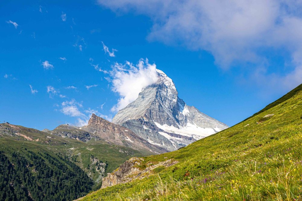 Matterhorn snowy summit in clouds viewed from the slopes above Zermatt