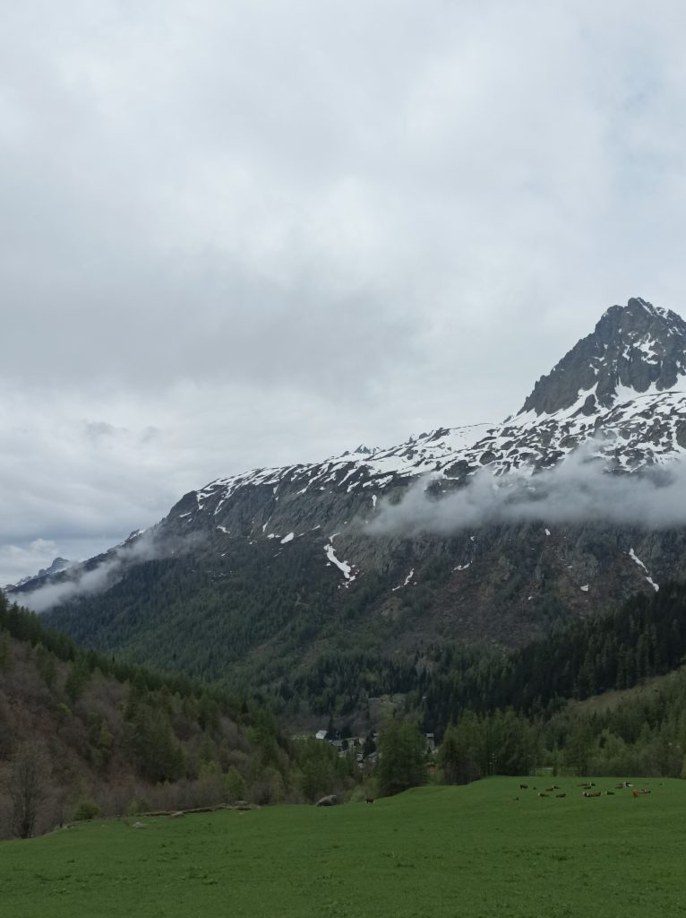 The TMB trail heads to the ladders which cross the large slabs of rock on the right.