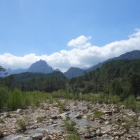 GR20 View of the Corsican mountain ranges from a dry river bed